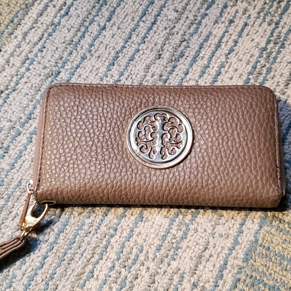 Beige wristlet with zipper closure
